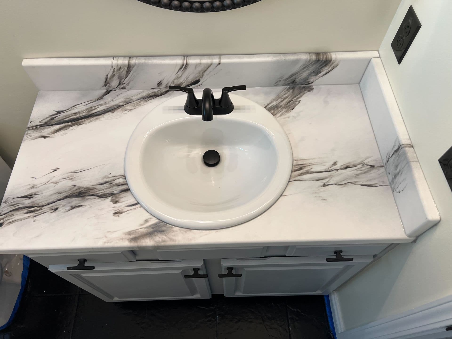 Modern bathroom with gray cabinets and stoneart countertops - a clean, contemporary feel.