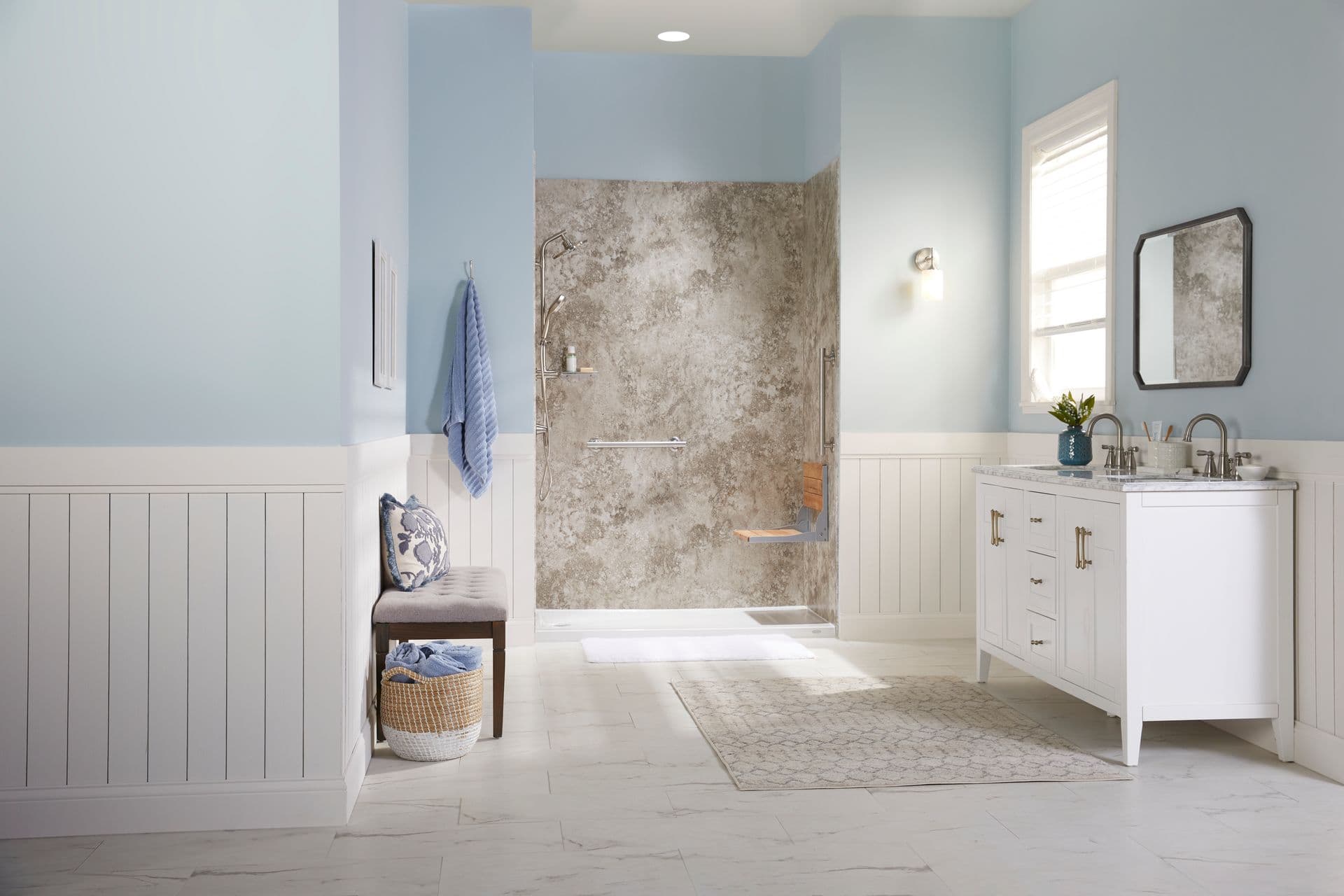 Light brown marbling walk in shower with brushed nickel hardware and seat